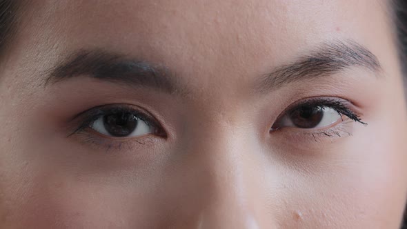 Close Up Details Human Body Part Female Dark Eyes Sad Asian Korean Girl Looking at Camera Woman with