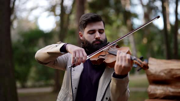a Classical Musician Plays the Violin in a City Park