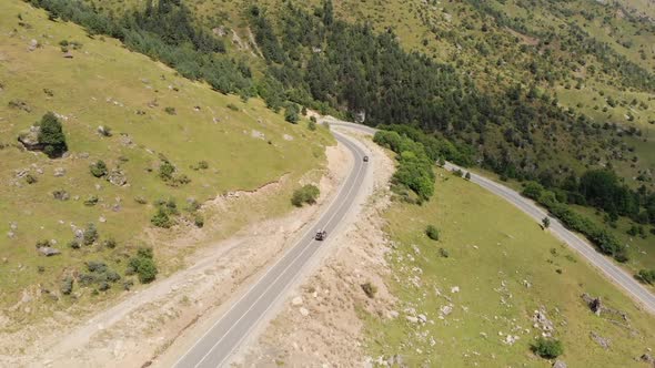 Road with Sharp Turn on Which Cars Are Driving, Top View From Quadrocopter in Aerials, Mountain Road