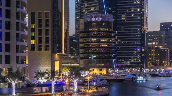 View of Dubai Marina Towers and Canal in Dubai Day to Night Timelapse