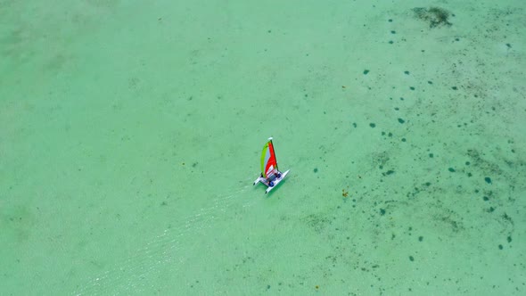 Boat Sailing At Pristine Water Of Juanillo Beach In Punta Cana, Dominican Republic. aerial