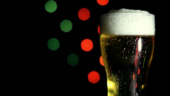 A Glass of Cold Beer on a Black Background