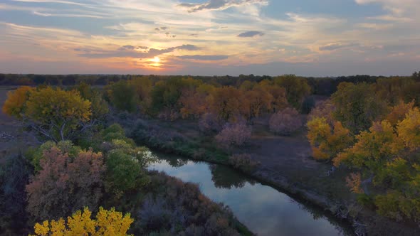 Veneers of color lay atop one another in the fall season in Northern Colorado.  A sunset with colors