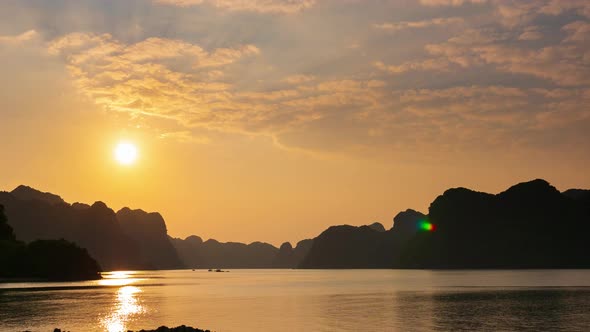 Time lapse: Vietnam Cat Ba bay at sunset with floating fishing boats on sea, cloudscape 