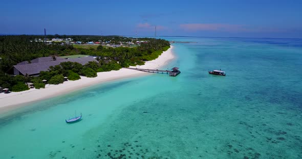 Wide angle aerial travel shot of a summer white paradise sand beach and aqua blue ocean background i