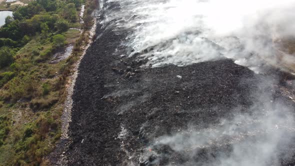 Aerial view fire burn at garbage dump