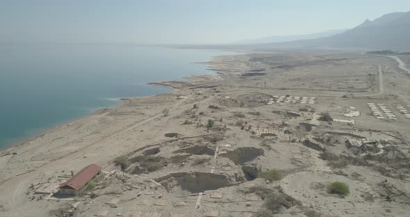 Aerial view of colourful sinkholes at dead sea, Negev, Israel.