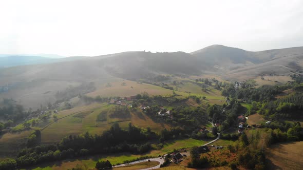 Aerial View of Green Hills of Pester Plateau Mountain Region in Western Serbia on Summer Day Drone