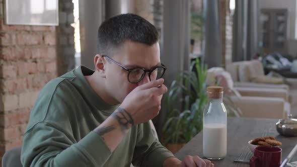 Man Using Laptop During Breakfast