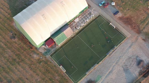 Green pitch for mini football made of artificial turf and air supported recreational sports dome