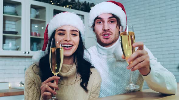 Happy couple celebrating christmas at home.