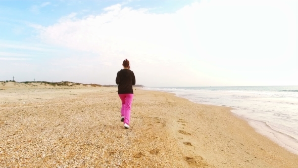 Young Woman Jog At Sand Sea Coast
