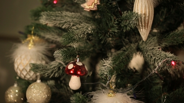 Girl Hangs On a Beautiful Christmas Tree Toy