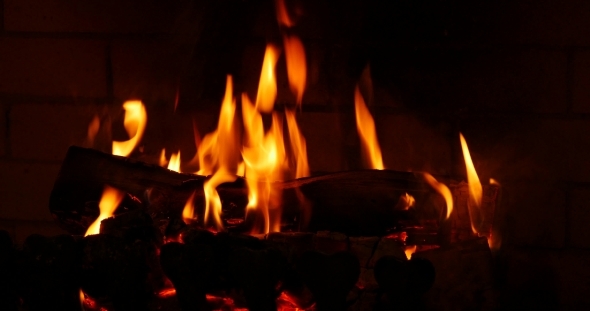 The Dying Embers In The Fireplace