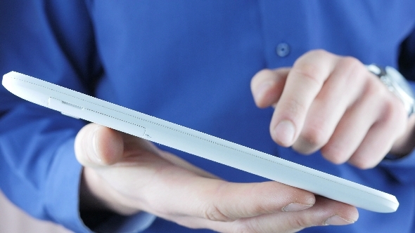 Businessman Typing Sms In Office