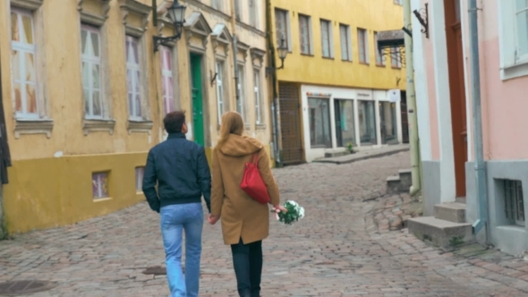 Loving Couple Having a Walk In Old Empty Street