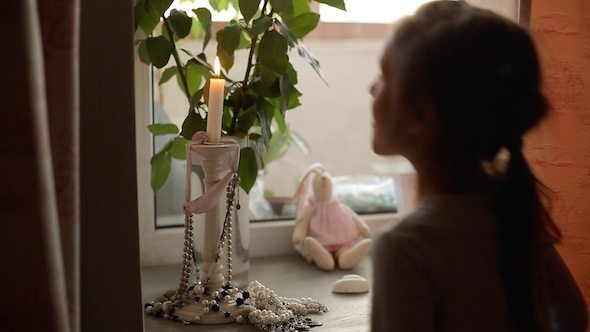 Girl Blowing Candle