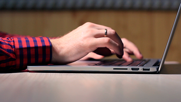 Man Typing On Laptop 