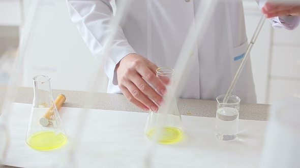 Researcher Works With Fluids In Chemical