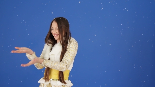 Pretty Snow Maiden Enjoying Falling Snow In Studio