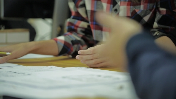 Expert Group Of People Pass Each Other Papers And