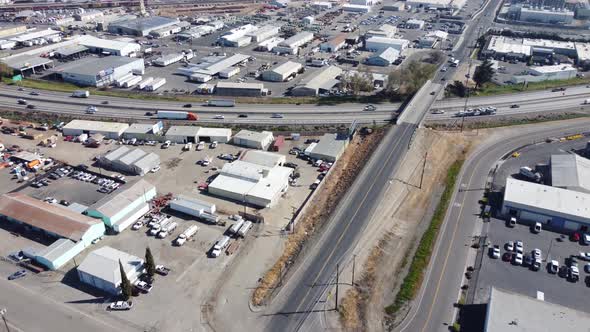 Aerial Drone of Freeway and Streets in Industrial City Area 4k