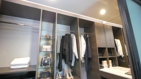 Walk-in Closet full with clothes and Accessories