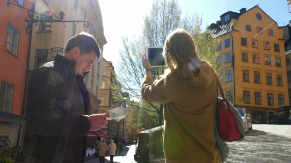 Two Tourists Walking In Stockholm