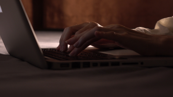 Working On Laptop In Bed alt