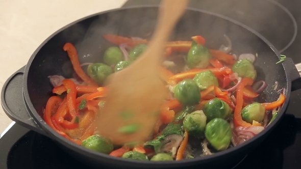 Red Paprika, Brussel Sprouts And Onions Frying