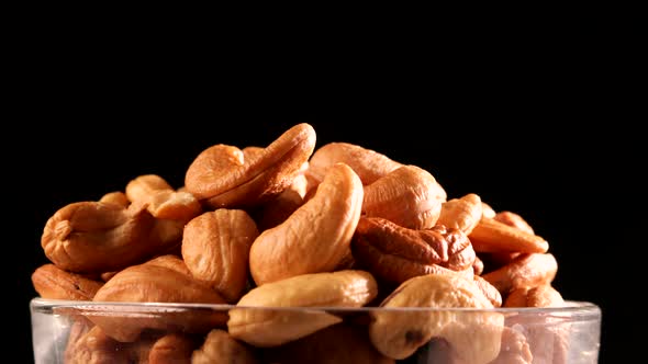 Video of cashews nut rotates slowly. Closeup shot in 4K resolution. Healthy food