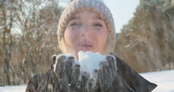 Young Woman Blows Snow Her Hands Forest