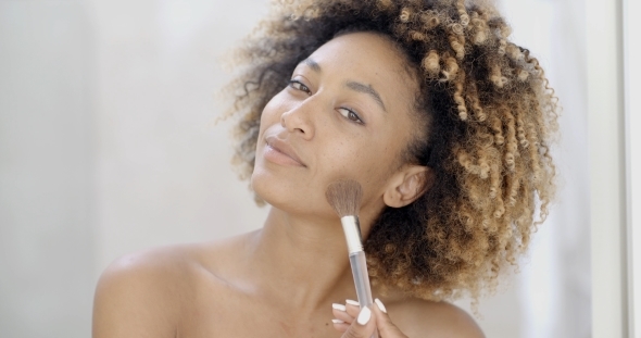 Young Woman Putting Make Up