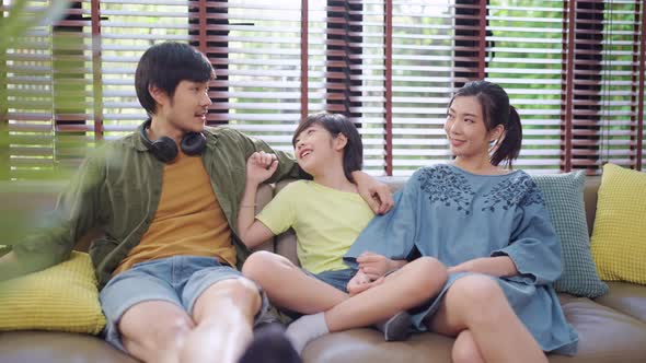 Asian family sit relax positive conversation with son, happiness smile boy casual talking