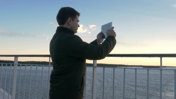 Adult Man With Tablet On Cruise Ship