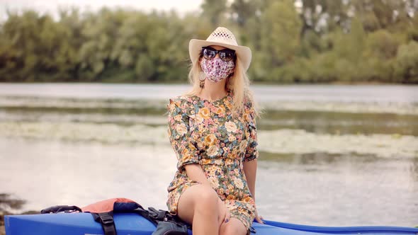 Woman In Face Mask Epidemic Coronavirus Prevention On Lockdown. Girl In Modern Face Mask In Summer.