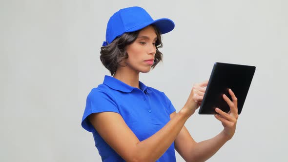 Delivery Girl in Blue Uniform with Tablet Computer