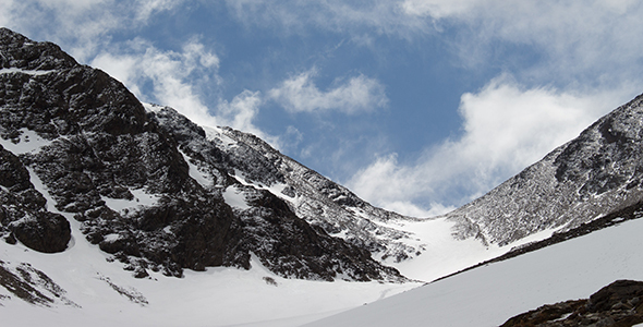 Storm Breaks over Snowy Mountain Pass