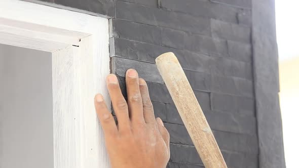 Worker Install Stone Wall Surface With Cement For House 1