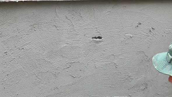 Worker Plastering Concrete At Wall Of House Construction 7