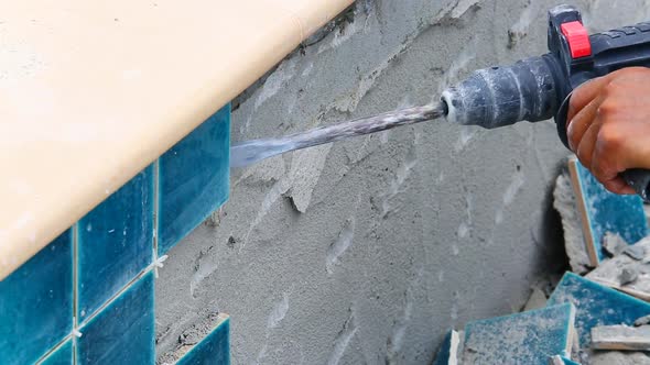 Worker Used Impact Drills For Repair Tile Wall 1