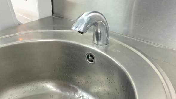 Washing Hands Under Running Water