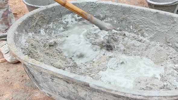Labor Mixing Concrete For Construction Job 2