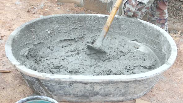 Labor Mixing Concrete For Construction Job 7