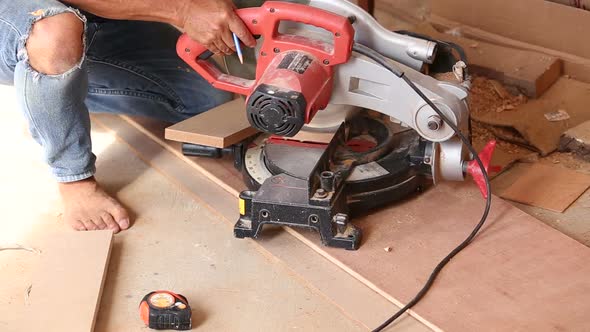 Carpenter Use Saw Cut Wood For Make New Furniture 1