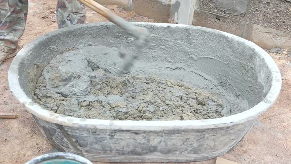 Labor Mixing Concrete For Construction Job 8 alt