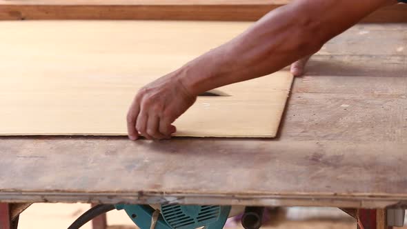 Carpenter Use Saw Cut Wood For Make New Furniture 10 alt