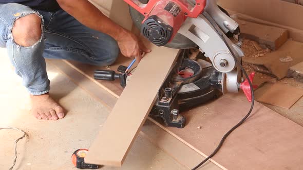 Carpenter Use Saw Cut Wood For Make New Furniture 2