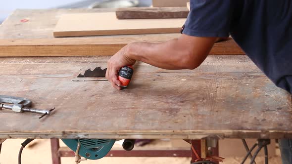 Carpenter Use Saw Cut Wood For Make New Furniture 4