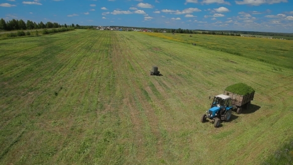 Aerial Footage Of a Tractor In Field Russia
